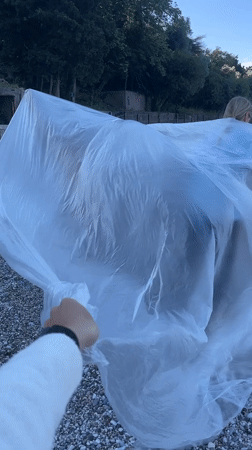 Photography session with plastic sheets on Montenegro beach