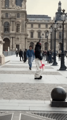 Visitor documents afternoon tour of Louvre Museum and Notre-Dame