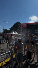 Summer carnival underway in Kiel with rides, crowds, and live stage
