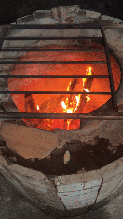 Flatbread preparation documented at tandoor oven in Kartubani, Georgia