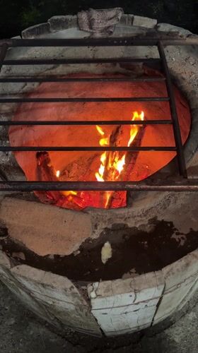 Flatbread preparation documented at tandoor oven in Kartubani, Georgia