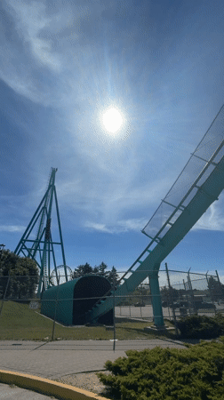 Roller coaster filmed against blue sky in Vaughan