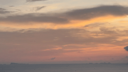 Sunset panorama documented from Thai coastal hillside viewpoint