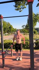 Man exercises at outdoor gym in Moscow park