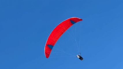 Morning scenes captured in Kuta Selatan: paragliding, beach, statues