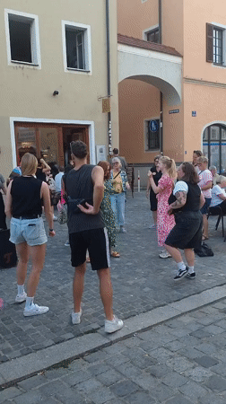 Pride festival and street life along Regensburg's Danube waterfront