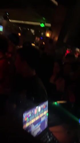 Nightclub Scene Captured in Liangjiang with DJ, Dancing, Sports TV