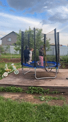 Family barbecue gathering with children playing in Ольховка, Russia