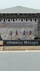 Children perform traditional folk dances at cultural event in Bulgaria