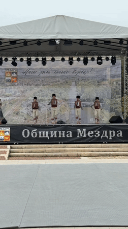 Children perform traditional folk dances at cultural event in Bulgaria