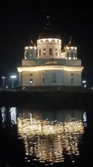 Evening photography captures illuminated Kokshetau landmarks and waterfront reflections