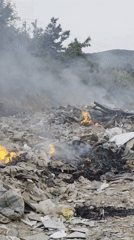 Waste pile burns in Bac Nha Trang Ward, Vietnam