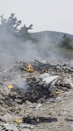 Waste pile burns in Bac Nha Trang Ward, Vietnam
