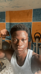 Man films workout poses in colorful home gym