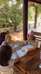 Children doing homework at outdoor table in Mũi Né