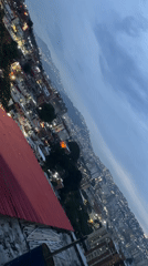 Evening cityscape captured in Caracas showing illuminated urban density