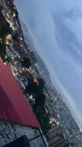 Evening cityscape captured in Caracas showing illuminated urban density