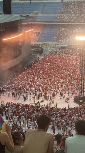 Packed stadium concert lights up Milan on a July evening