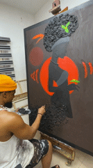 Artist paints on large canvas in Ado workspace