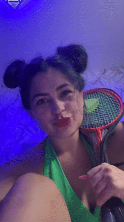 Woman poses with badminton racket in Russia