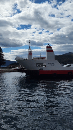 Ferry operations documented at Lepetani, Montenegro with passenger vehicles