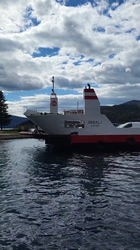 Ferry operations documented at Lepetani, Montenegro with passenger vehicles