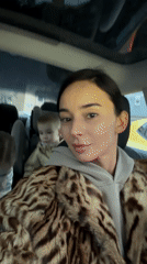 Woman takes selfies in car with children in Rijeka