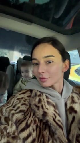 Woman takes selfies in car with children in Rijeka