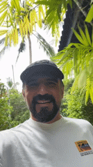 Man records cheerful selfie video in tropical Thailand setting