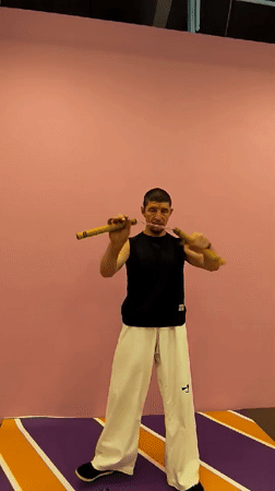 Nunchaku drills in a decorated Karaganda indoor training space