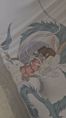Artist examines anime drawing and surreal book cover in Barcelona