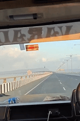 Truck driver crosses bridge, dashboard view captured on video