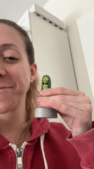 Woman unboxes talking Pickle Rick toy in Amsterdam