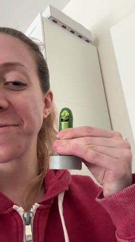 Woman unboxes talking Pickle Rick toy in Amsterdam