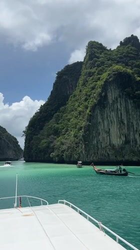 Longtail boats weaving through Ao Nang's turquoise karst channels