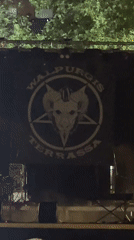 Illuminated Walpurgis banner with occult symbols displayed in Terrassa