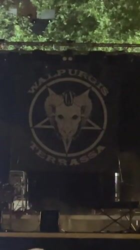 Illuminated Walpurgis banner with occult symbols displayed in Terrassa