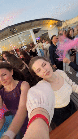 Boat party drifting through Saint Petersburg on the longest day