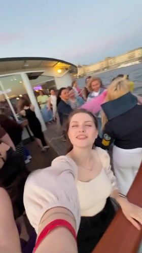 Boat party drifting through Saint Petersburg on the longest day