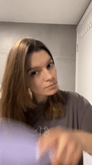 Woman completes evening bathroom routine in Limassol, Cyprus