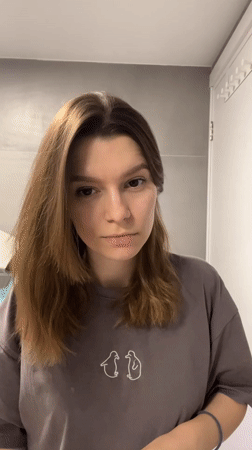Woman completes evening bathroom routine in Limassol, Cyprus