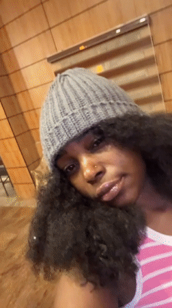 Woman takes mirror selfies in Abuja hotel room