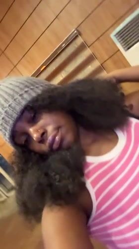 Woman takes mirror selfies in Abuja hotel room