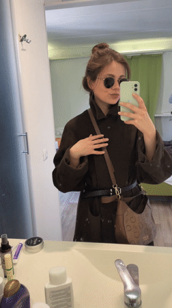 Woman takes bathroom mirror selfies in Venice