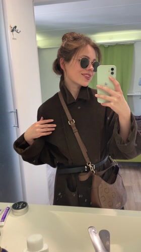Woman takes bathroom mirror selfies in Venice