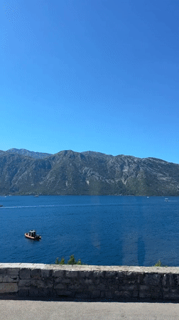 Bay of Kotor calm and blue, mountains rising from the water