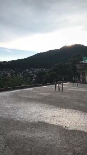 Rooftop life documented in Haini: exercise, cat, mountain views