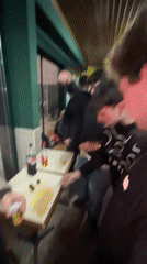 Late-night social gathering observed at Bragança bar