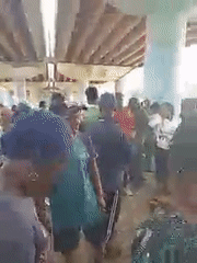 Group gathers under painted overpass in Jos, Nigeria