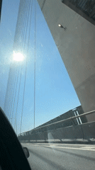 Car passengers document sunny highway journey toward London Oxford area